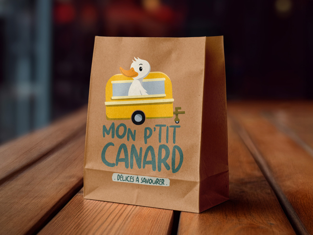 Sac en papier avec illustration de canard mignon.