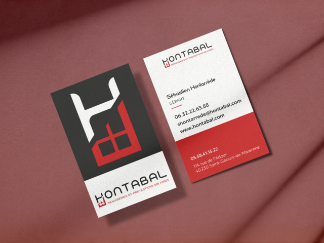 Cartes de visite Hontabal sur fond rouge.